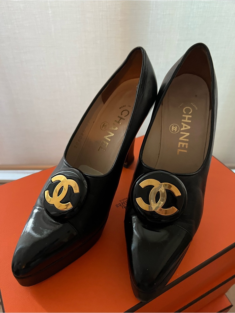 CHANEL Black Leather Pointed Toe Pumps with Gold CC Medallion